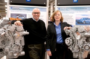 Bay City Powertrain Plant Manager Joe Mazzeo (left) and Flint Powertrain Plant Manager Kathleen Dilworth pose with 1.4L engines their plants will be producing.