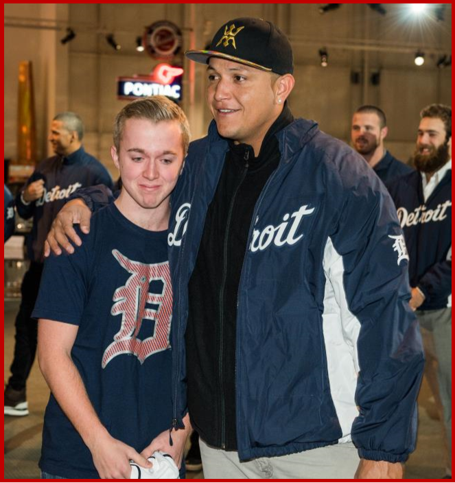 Detroit Tigers first baseman Miguel Cabrera embraces Andrew Brunell, 16, after presenting him with a personalized Tigers jersey Friday, January 22, 2016 as the Detroit Tigers caravan stopped at the General Motors Heritage Center in Sterling Heights, Michigan. Andrew got to meet Cabrera, and the rest of his favorite Tigers players as part of the Make-a-Wish program.